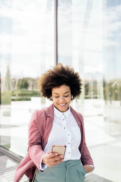 istock Afro Woman Using Phone 1442792545