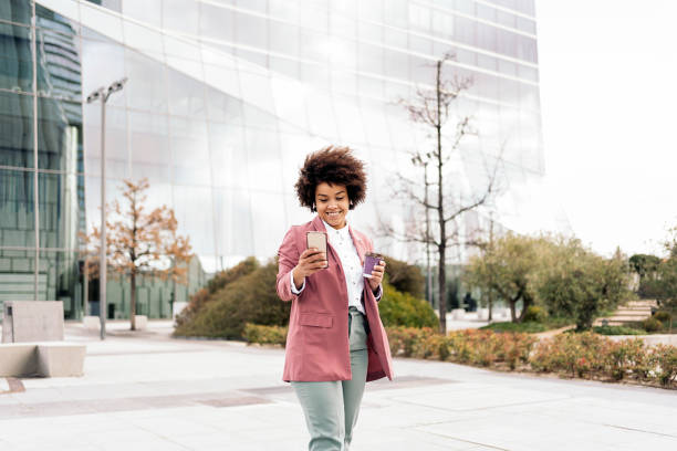 istock Black Business Woman Using Cellphone 1442793366