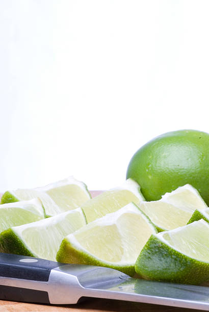 Fresh Cut Limes (Vertical) stock photo