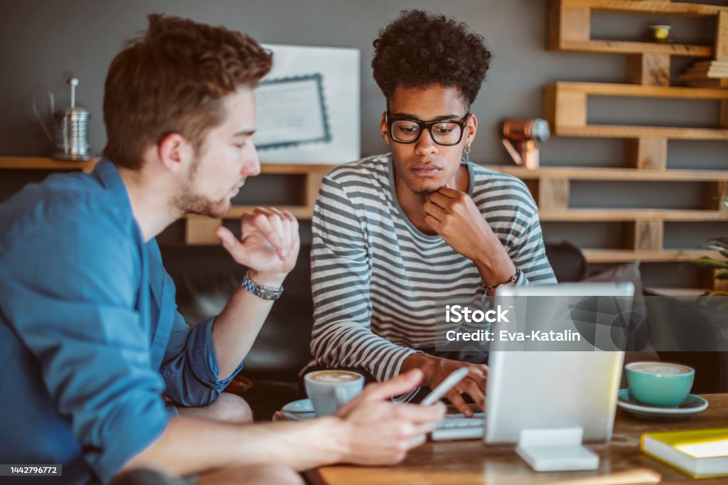 Young men working at home office Computer Programmer Stock Photo