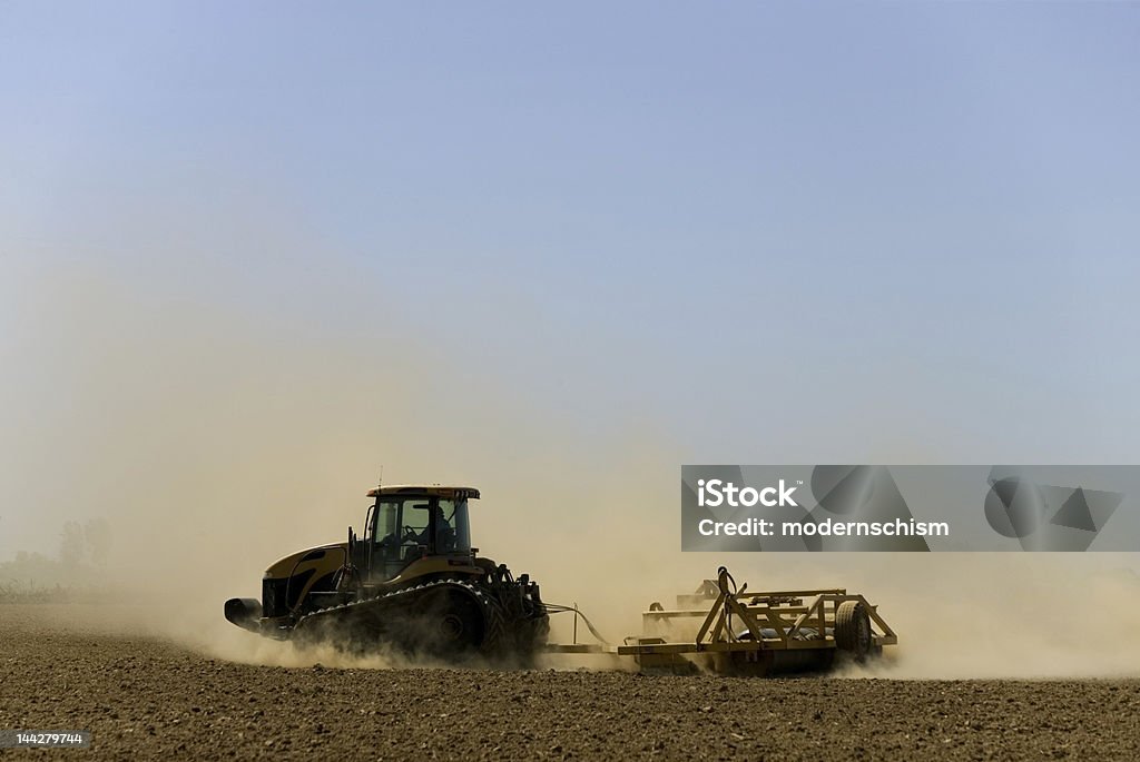 dustbowl farming mid-valley california farmer preparing field during windstorm with resulting cloud of topsoil. Dust Bowl Stock Photo