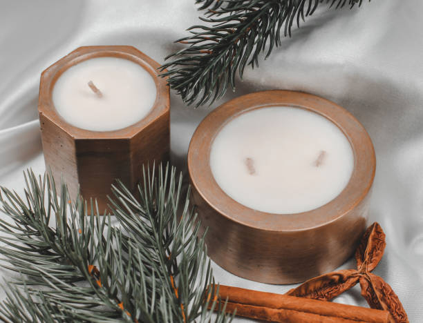 istock Decorative candles in a pot and fir branches, festive composition, selective focus 1442798194