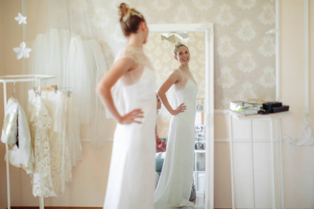 The bride is trying out her wedding dress