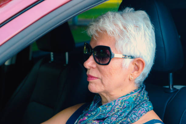 istock Lady in a red car 1442799957