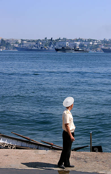 istock sea officer looking at navy ships 144280182