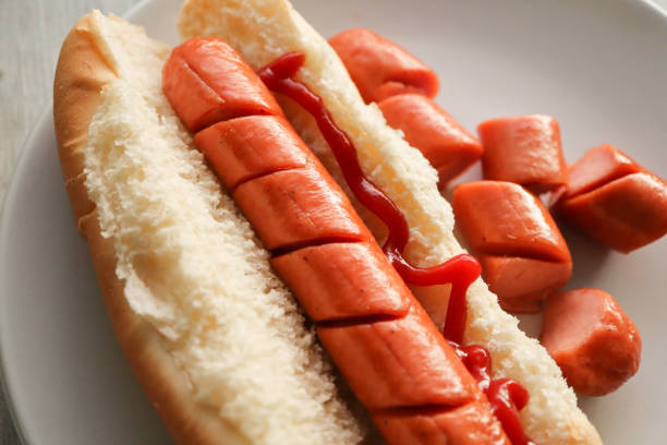 Hotdog with tomato sauce. Ketchup