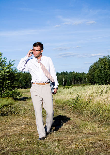 Buisnessman  on the phone Buisnessman  on the phone environment computer cloud leadership stock pictures, royalty-free photos & images