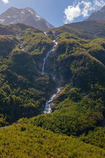 Tana glacier in North Ossetia, mountain waterfalls in the highlands