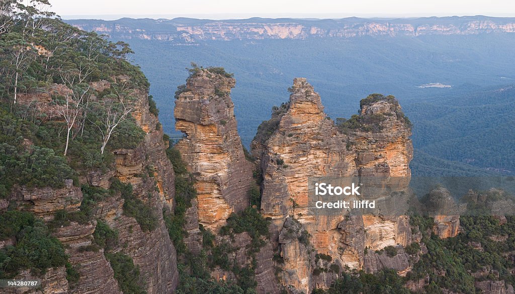 Three Sisters of the Blue Mountains The wonderful Three Sisters near Katoomba, west of Sydney, Australia, showing the aptly named Blue Mountains in the background. Australia Stock Photo