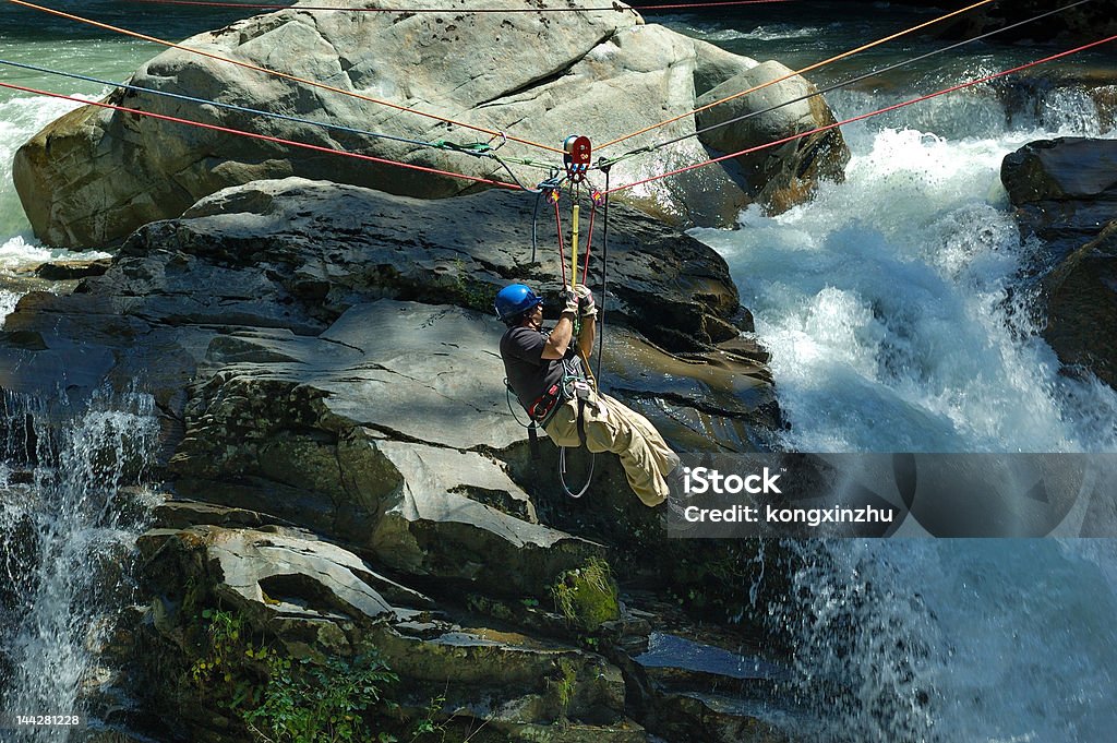 rescuer on duty rescuer on duty in front of a water falls Adventure Stock Photo