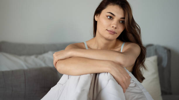 istock Woman smiling in the bed after waking up 1442816638