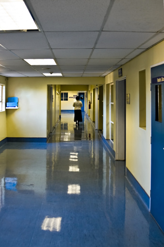 mid age woman walking on the hospital hallway, healthcare series