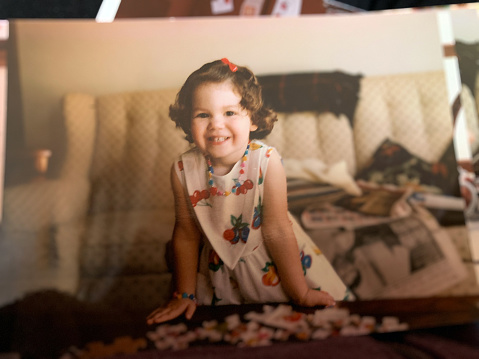 head shot of a cute little girl on a black backround