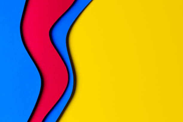 istock Abstract colored paper texture background. Minimal paper cut style composition with layers of geometric shapes and lines in red and light blue colors on yellow background. Top view 1442819088
