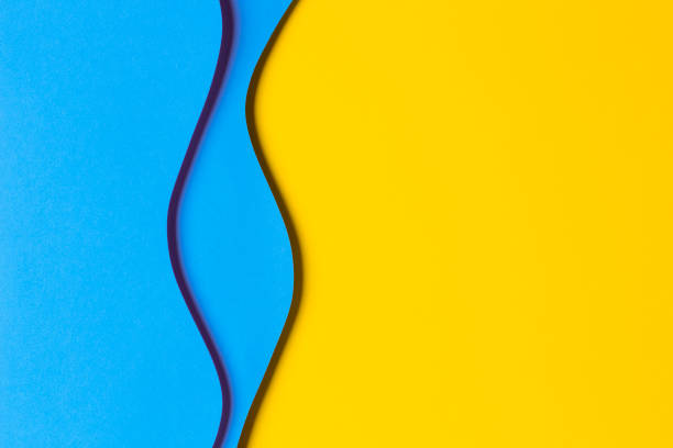 istock Abstract colored paper texture background. Minimal paper cut style composition with layers of geometric shapes and lines in yellow, light blue and green colors. Top view 1442819139