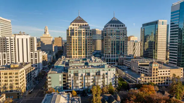 Aerial stock photo of downtown Oakland California looking East towards City Hall and the Oakland Federal building containing the United States District court for the Northern District.