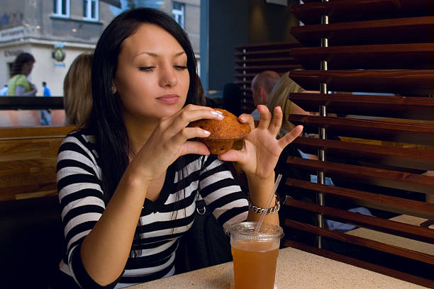 istock woman eat in cafe 144281958