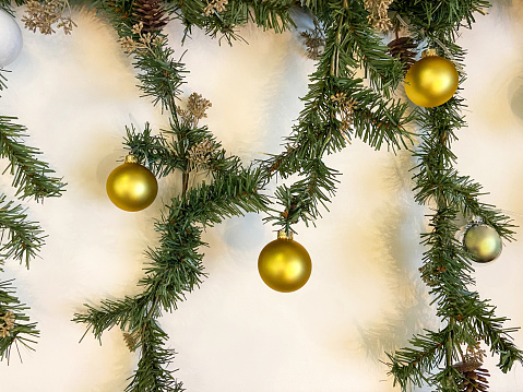 Christmas corner decoration with pine twigs and balls isolated on white background