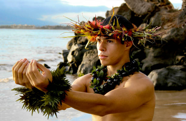 istock Male Hula Dancer poses with hands reaching out. 1442822196