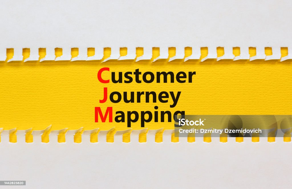 CJM customer journey mapping symbol. Concept words CJM customer journey mapping on yellow paper on a beautiful white background. Business and CJM customer journey mapping concept. Copy space. Content - Information Medium Stock Photo