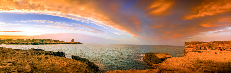 Panoramic view of the Adriatic coast of Salento, Southern Italy, near Roca Vecchia. The picture was taken at sunset.