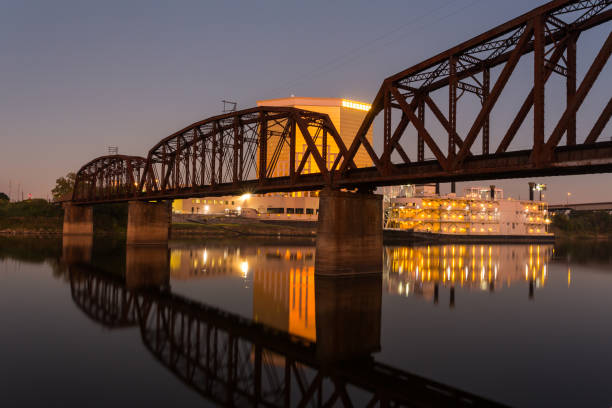 Shreveport, Louisiana, USA - October 26th, 2022: Beautiful sunset the Red River and railroad bridge