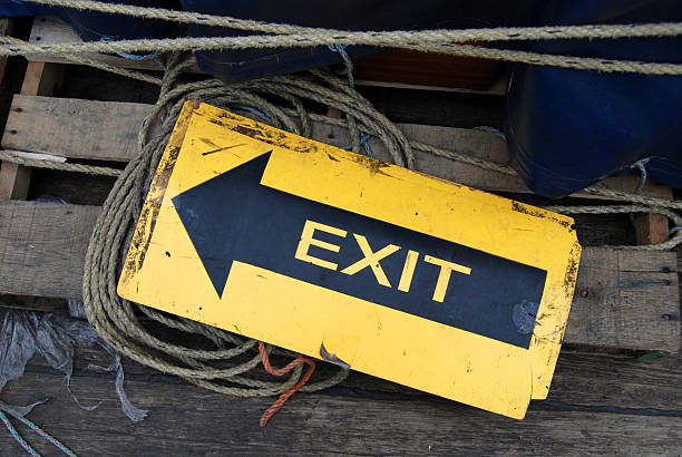 Grungy Yellow Exit Sign stock photo