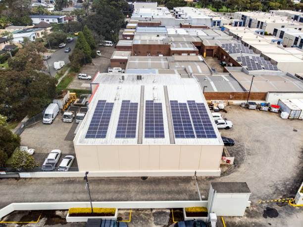 Aerial view of Industrial buildings with air ducts and solar panels, background with copy space stock photo