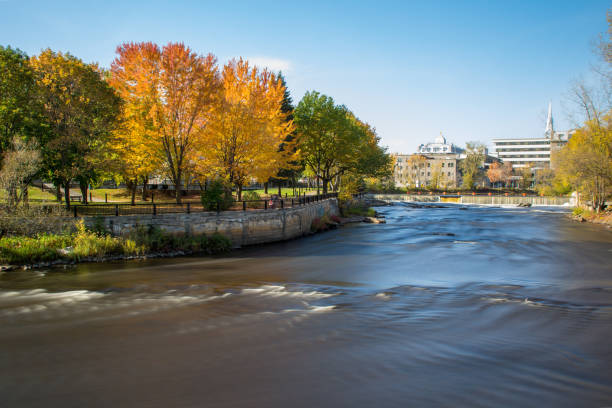 Slow motion streaming water. Waterfalls in L'Assomption river, Joliette, Quebec, Canada