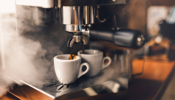 istock Portafilter machine pours fresh coffee into espresso cups 1442830066