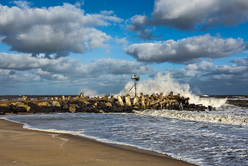 A wave crashing on a Jetty in point Pleasant, NJ at Manasquan Inlet. The large waves are the result of Hurricane Joaquin that is well out to sea in October 2015.