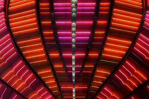 A neon sign outside of a Casino entrance on the Las Vegas Strip.