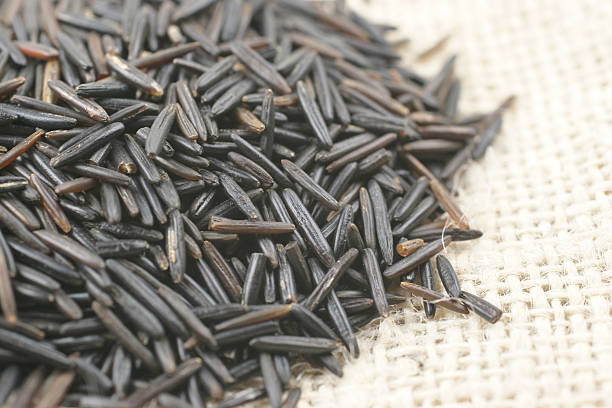 black rice on hessian stock photo