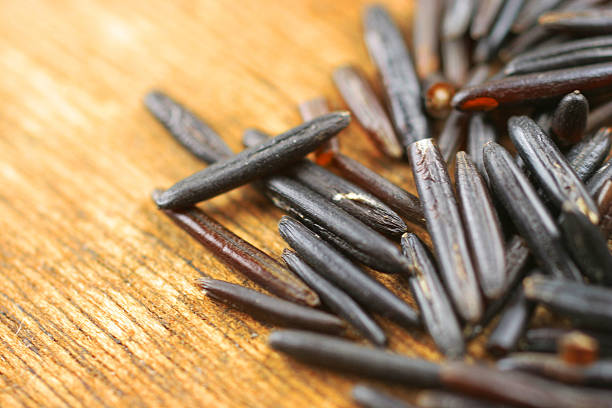 black rice on the wood stock photo