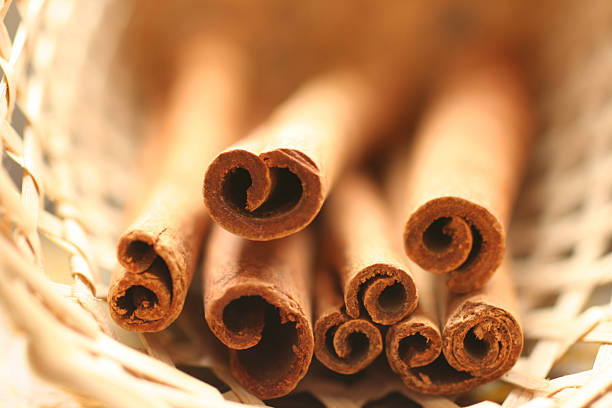 cinnamon in basket stock photo