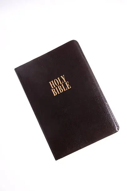 Leather bound bible isolated on white and tilted - see lightbox for more