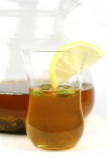 pot and glass of green tea stock photo