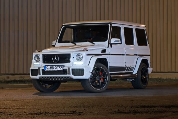 Berlin, Germany - 18th August, 2018: Mercedes-AMG G63 on a street at night. The G-Class is one of the most luxury SUV on a market.