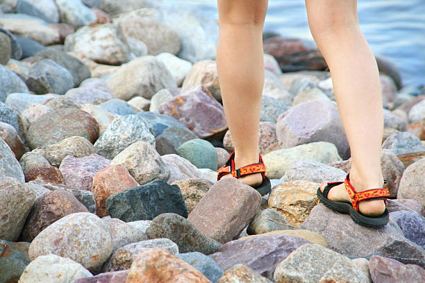 woman legs on the rocks stock photo