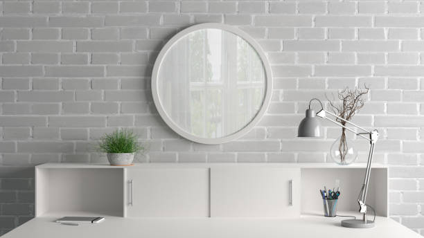 istock White round poster frame mock up on the AAA wall of home studio workspace. Front view. 1442835230