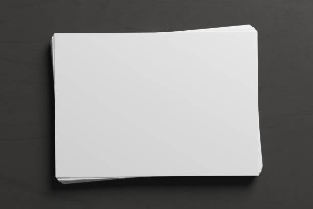 Black and white business cards mockup falling from above on black background