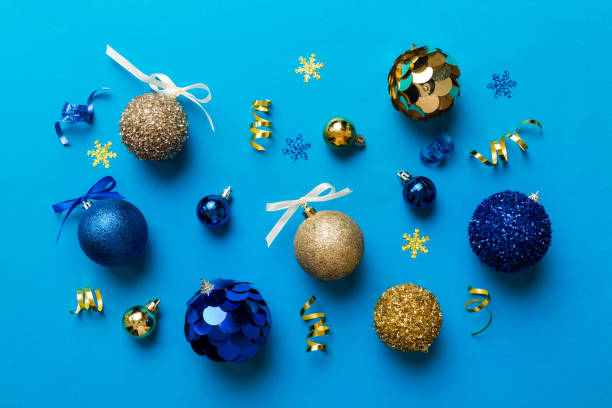 istock Christmas ball on colored background. decoration bauble with ribbon bow with copy space 1442837369