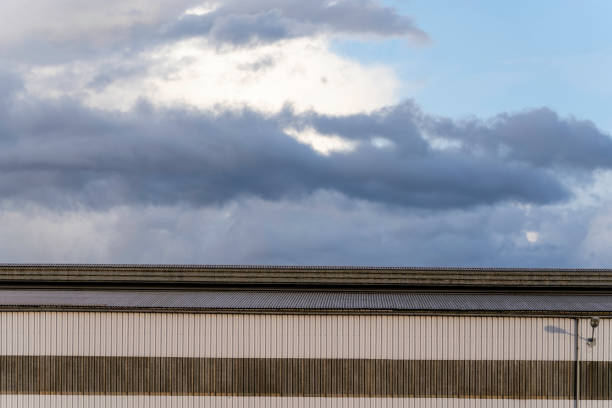 istock cool blue dramatic autumn sky with light dark blue gray clouds under which is a large tall building where the pei walls are a lantern 1442837843
