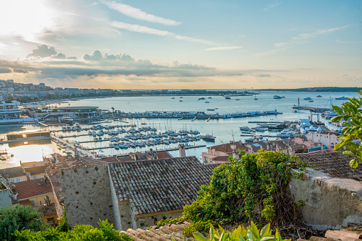 Gorgeous morning - sunset with Bay of Cannes, Yachts and Croisette, Palais (where the Cannes Film Festival takes place)  on French Riviera.