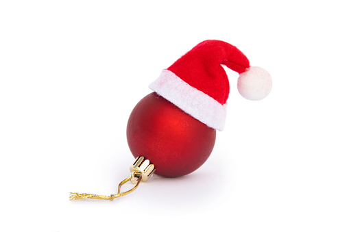 Christmas ball with Santa hat on white background