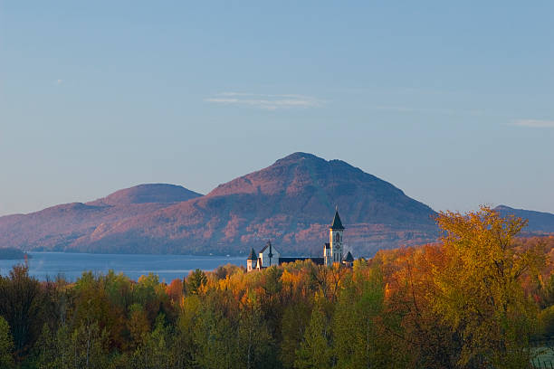 Morning color A beautiful autumn morning at the monastery by the lake MemphrAmagog. lake magog photos stock pictures, royalty-free photos & images