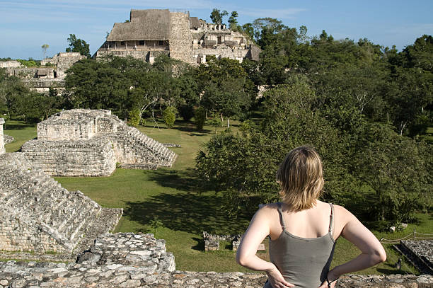 istock Woman looking over Maya Ruins 144284563