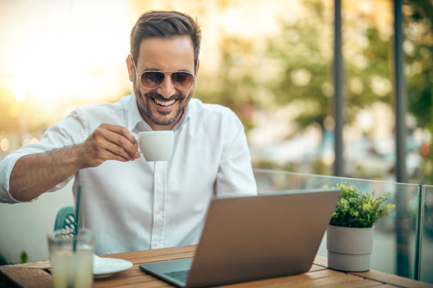 istock Businessman using laptop in cafe 1442846301