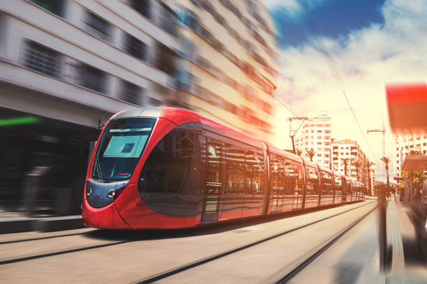 a tram passing on the railway in a sunny day