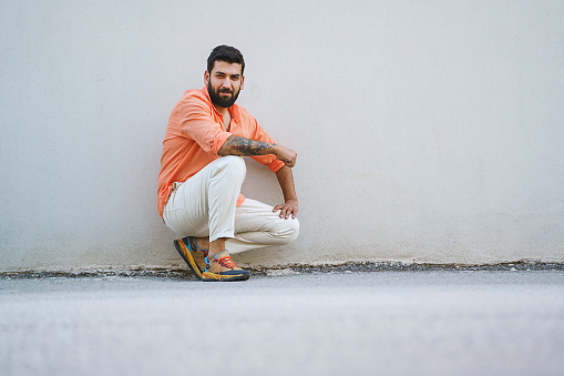 Fashionable young man posing on the street